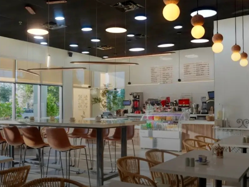 Cafe del Alma: a bright coffee-shop interior with pendant lights and relaxed seating